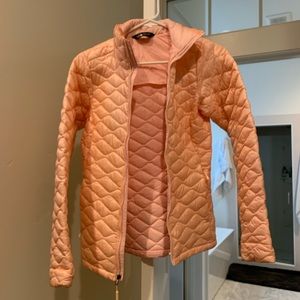 Light pink women’s North Face jacket